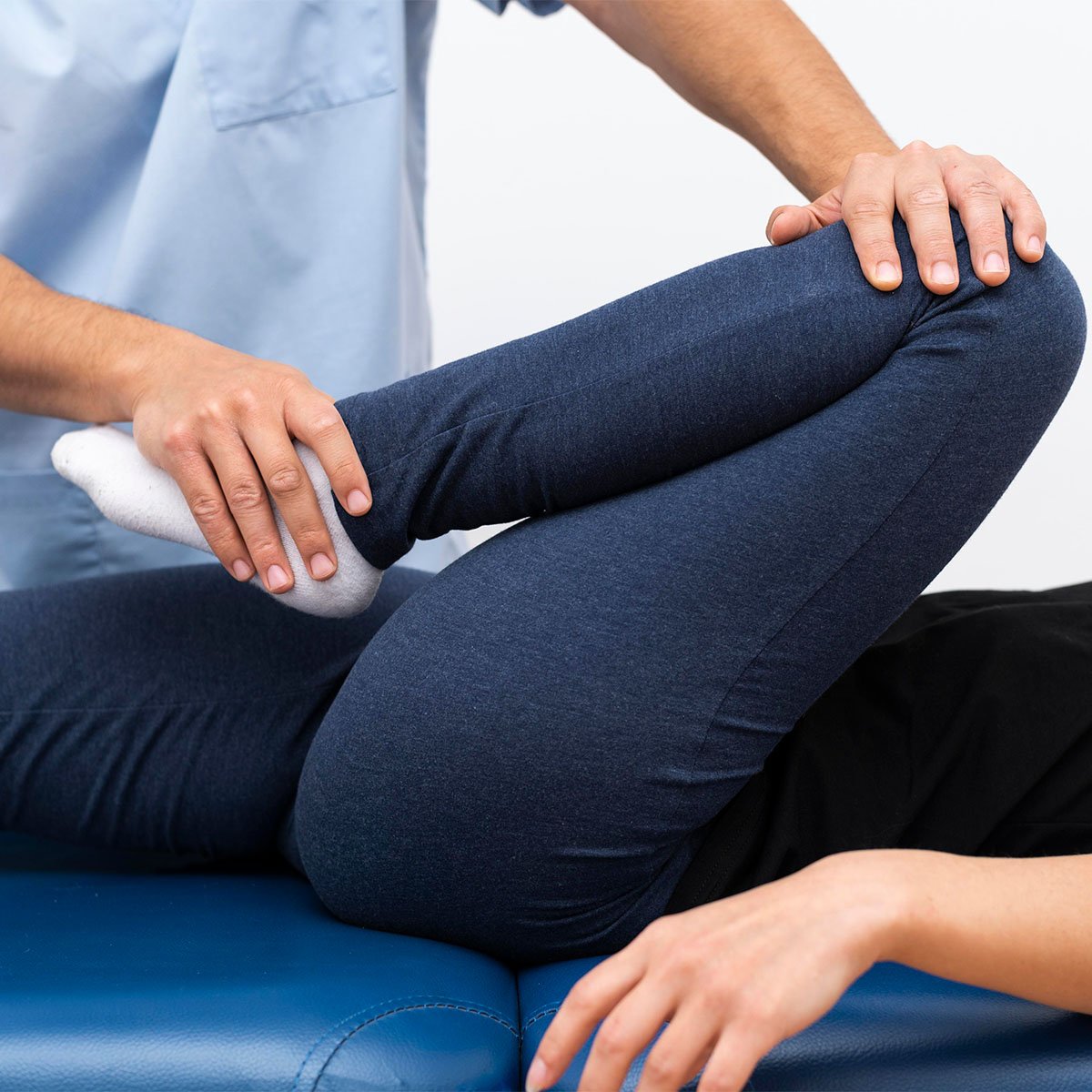 physiotherapist-doing-exercises-with-female-patient-square